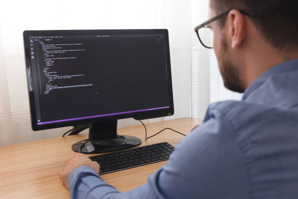 programmer working on online app development on PC
